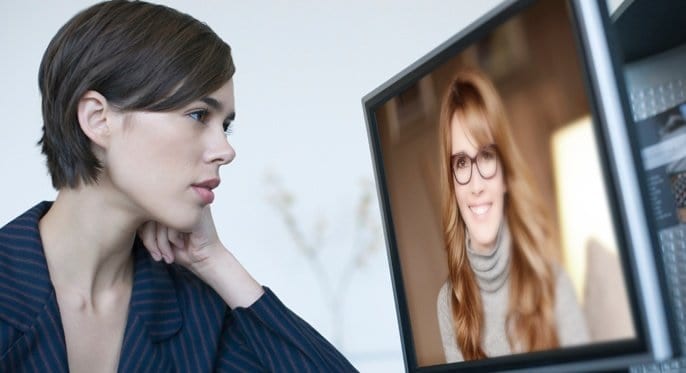 women talking on video conference