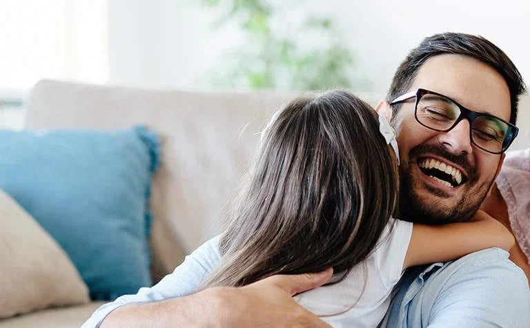 older couple smiling looking at each other
