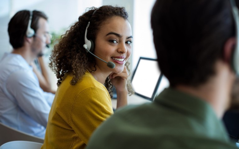 smiling woman in call center