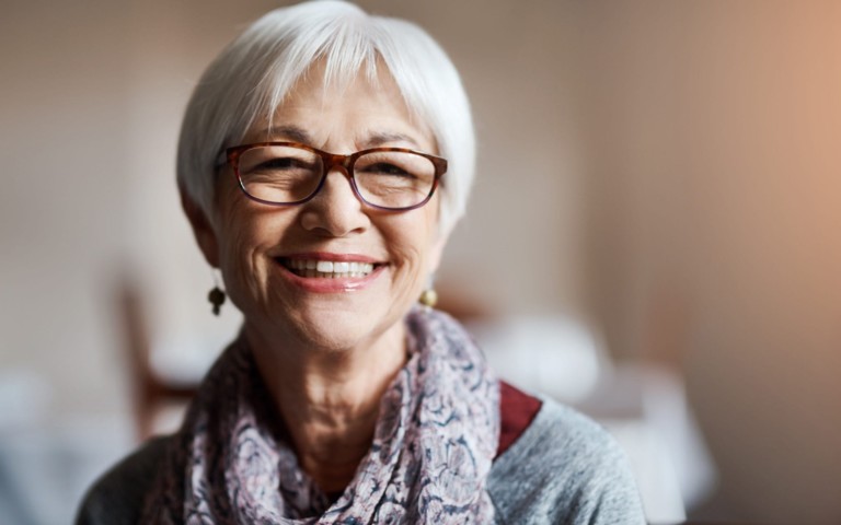 smiling older woman wearing glasses