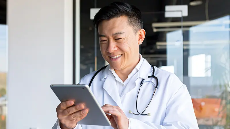 doctor checking ipad