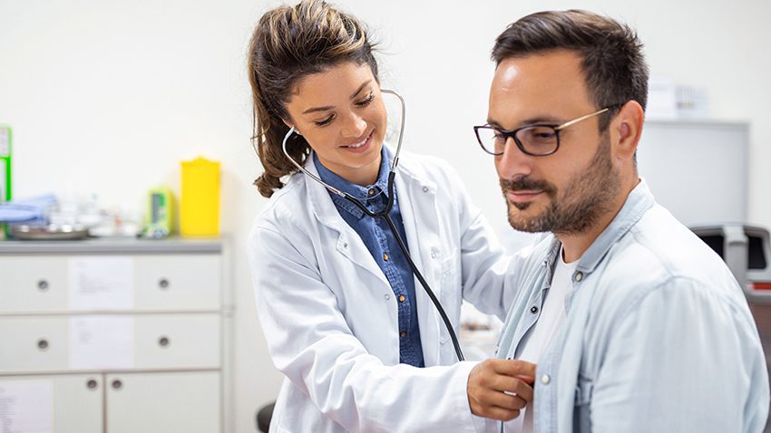 doctor checking patient with stethoscope