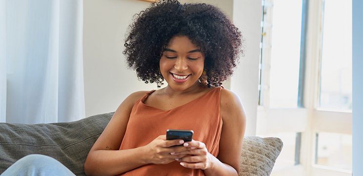 woman using mobile phone at home