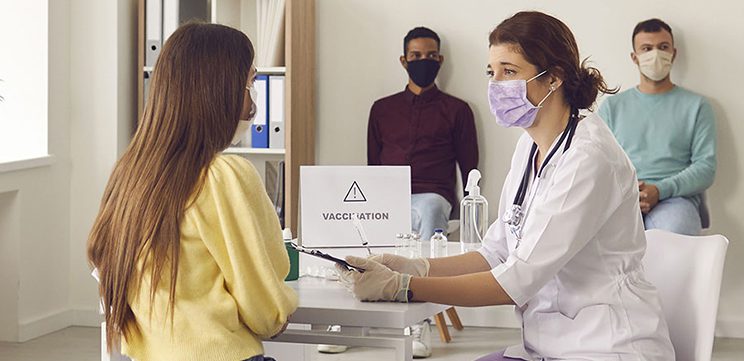 doctor and patient at flu shot clinic