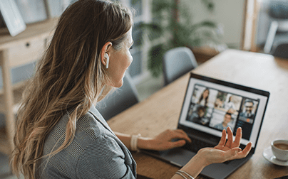 Healthcare professional on a video call with multiple participants, representing virtual connection and engagement in healthcare